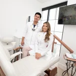 Dr. Andres Mu&ntilde;oz and Dr. Angee Mu&ntilde;oz in a treatment room at Harmony Smiles in Roselle Park, NJ